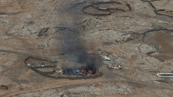 SUWAYDA, SYRIA - JULY 17: An aerial view of homes belonging to Bedouin Arabs are seen set on fire by members of the Druze community in Suwayda, Syria on July 17, 2025. Local armed groups have reportedly begun expelling families at gunpoint, prompting many