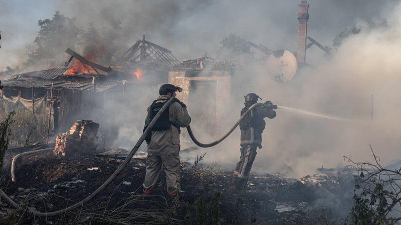 Ukrainian emergency service workers extinguish a fire in three houses after Russian shelling on the city of Kostiantynivka earlier this week
