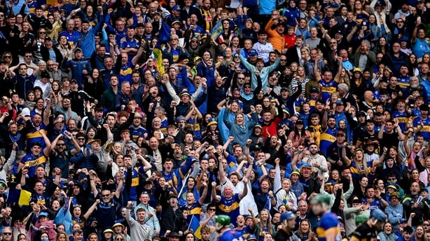 6 July 2025; Tipperary supporters in the Cusack stand celebrate during the GAA Hurling All-Ireland Senior Championship semi-final match between Kilkenny and Tipperary at Croke Park in Dublin. Photo by David Fitzgerald/Sportsfile