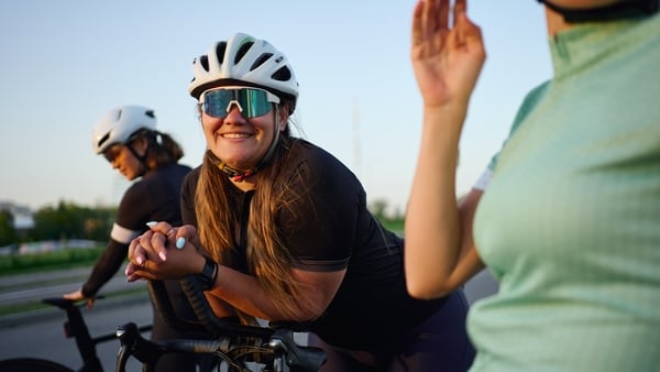 Three women cycling together