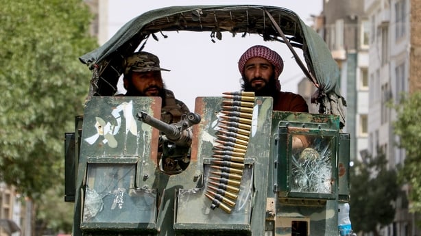 two men in a military vehicle
