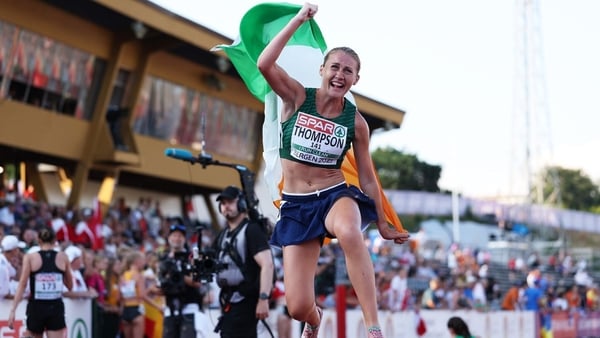 BERGEN, NORWAY - JULY 18: Gold medalist, Anika Thompson of Team Ireland, celebrates with the national flag after winning in the Women's 10,000m Final during the European Athletics U23 Championships 2025 Day 2 at Fana Stadion on July 18, 2025 in Bergen, No