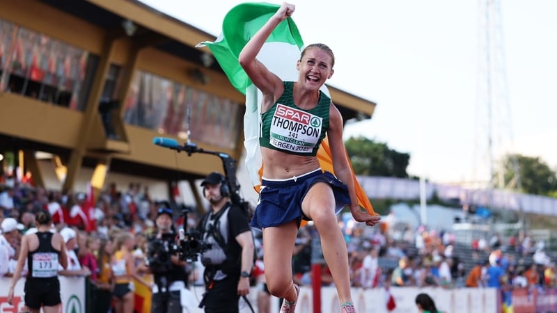 Anika Thompson celebrates with the Irish flag after claiming gold in Bergen
