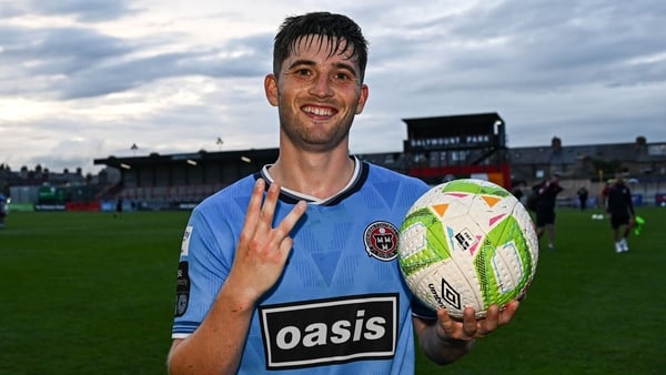 18 July 2025; Colm Whelan of Bohemians celebrates with the matchball after scoring a hat-trick during the Sports Direct Men’s FAI Cup second round match between Killester Donnycarney and Bohemians at Dalymount Park in Dublin. Photo by Seb Daly/Sportsfile