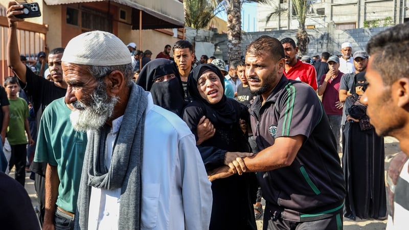 Palestinians mourn for those who were killed in an Israeli airstrike which targeted civilians waiting for aid at a US distribution point in Rafah