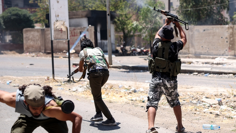 Bedouin tribal gunmen engage in combat with Druze fighters in a neighbourhood in Sweida in Syria's southern province