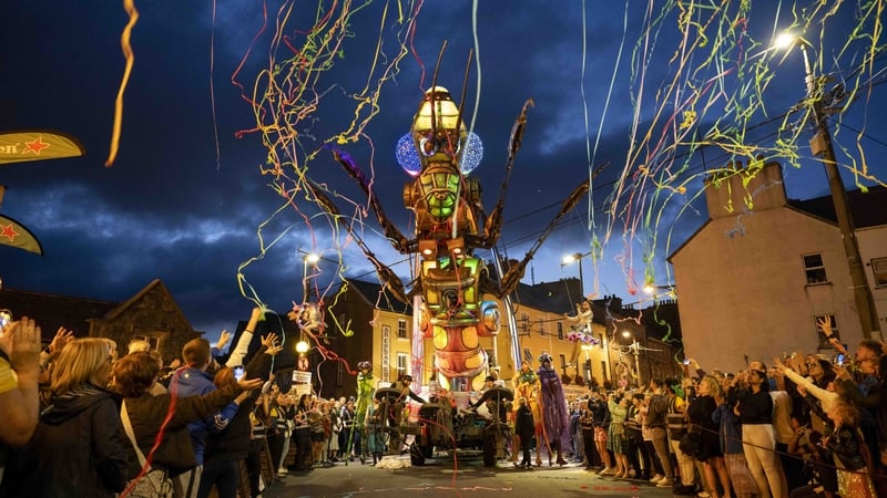 Audiences line the streets of during the Galway International Arts Festival