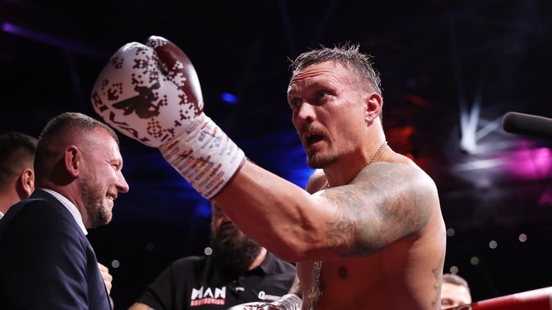 Oleksandr Usyk celebrates his win