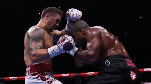 Ukraine's Oleksandr Usyk (L) and Britain's Daniel Dubois fight during their undisputed world heavyweight boxing title bout at Wembley Stadium in London on July 19, 2025. (Photo by Adrian Dennis / AFP)