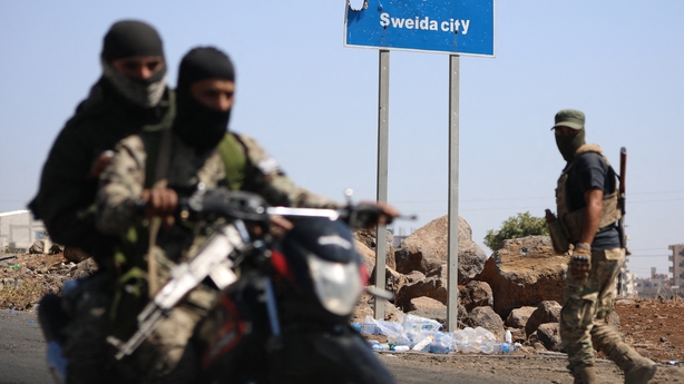 GETTY Tribal and bedouin fighters deploy in the western neighbourhood of southern Syria's predominantly Druze city of Sweida