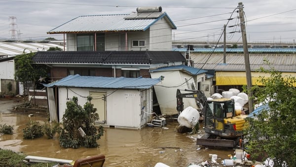 Villagers clean up and repair their flooded house in Yesan-Gun, South Korea, on July 18, 2025. Torrential rains that slam South Korea for three days leave four people dead, two missing, and more than 5,600 people evacuated, officials say on Friday, as wea