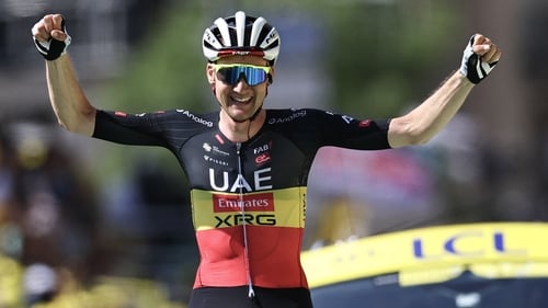 Tim Wellens soaks up the cheers as he crosses the line