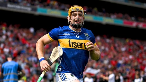 20 July 2025; Tipperary captain Ronan Maher runs onto the pitch before the GAA Hurling All-Ireland Senior Championship final match between Cork and Tipperary at Croke Park in Dublin. Photo by Stephen McCarthy/Sportsfile