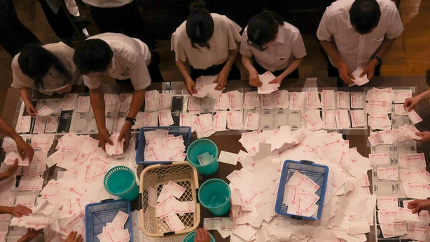 Election staff members count votes at a ballot counting centre on July 20, 2025 in Osaka, Japan
