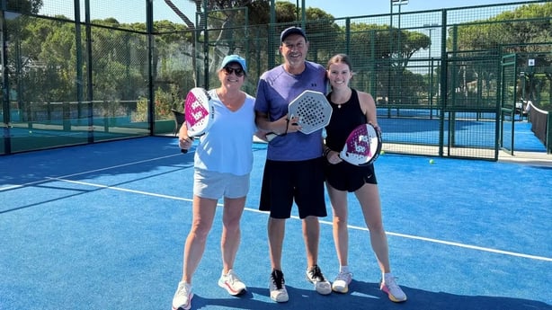 Hannah Stephenson and her daughter, Grace, with padel instructor Labisa Palmera 