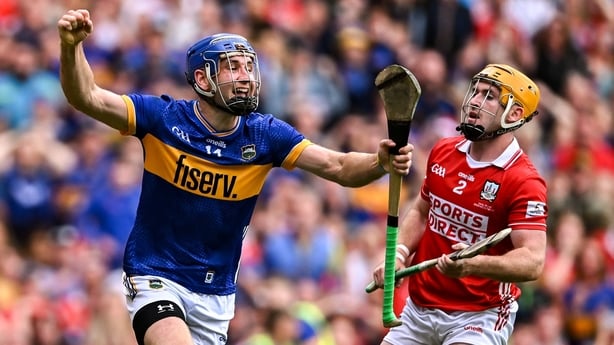 Tipperary and Cork playing hurling in final