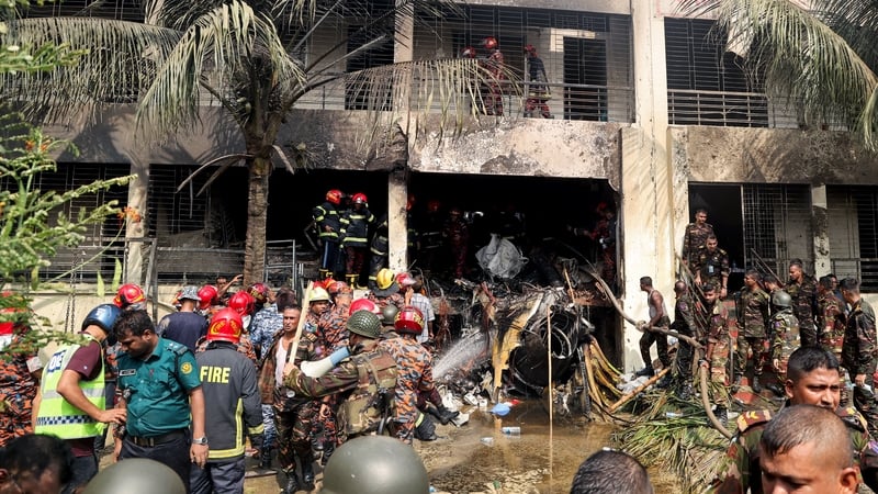 Bangladesh's fire service and security personnel conduct a search and rescue operation