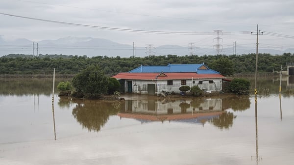 A flooded house and rice field in Yesan-Gun, South Korea