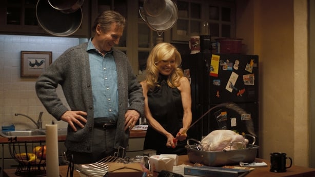 Liam Neeson plays Frank Drebin Jr. and Pamela Anderson plays Beth Davenport in The Naked Gun from Paramount Pictures.