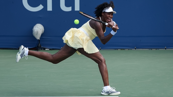 WASHINGTON, DC - JULY 21: Venus Williams returns a shot during a women’s doubles match with Hailey Baptiste (not pictured) against Eugenie Bouchard and Cleave Ngounoue (not pictured) on day 1 of the Mubadala Citi DC Open 2025 at William H.G. FitzGerald Te