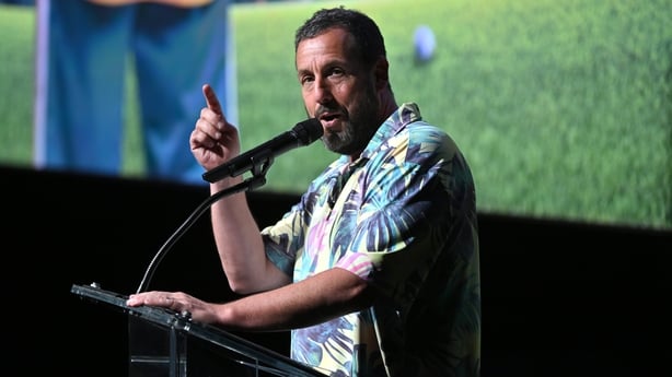 NEW YORK, NEW YORK - JULY 21: Adam Sandler speaks onstage during the Happy Gilmore 2 World Premiere at Jazz at Lincoln Center on July 21, 2025 in New York City. (Photo by Roy Rochlin/Getty Images for Netflix)