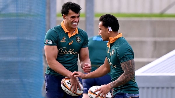 Australian Wallabies player Joseph-Aukuso Suaalii (C) chats with teammate Len Ikitau (R) during a training session in Melbourne on July 22, 2025, ahead of the second rugby Test match against the British and Irish Lions to be played on July 26. (Photo by W