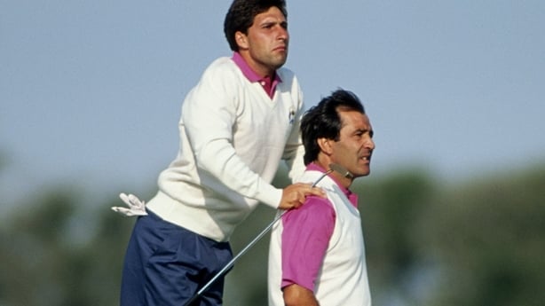 Jose-Maria Olazabal of Spain jumps up and uses the shoulders of compatriot Seve Ballesteros to get a better view of the course during the 29th Ryder Cup Matches on 28th September 1991 at Kiawah Island in So