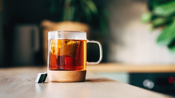 Tea bag put in transparent glass teacup