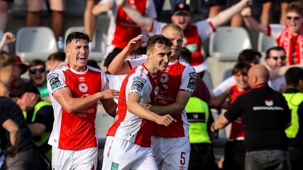 Mason Melia of St Patrick's Athletic, centre, celebrates with teammates Joe Redmond, left, and Tom Grivosti after scoring his side's first goal during the UEFA Conference League First Qualifying Round second leg match between FC Hegelmann and St Patrick's Athletic at Raudondvaris Stadium in Raudondv