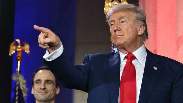 US President Donald Trump gestures after signing an executive order on artificial intelligence at the Andrew W. Mellon Auditorium in Washington, DC