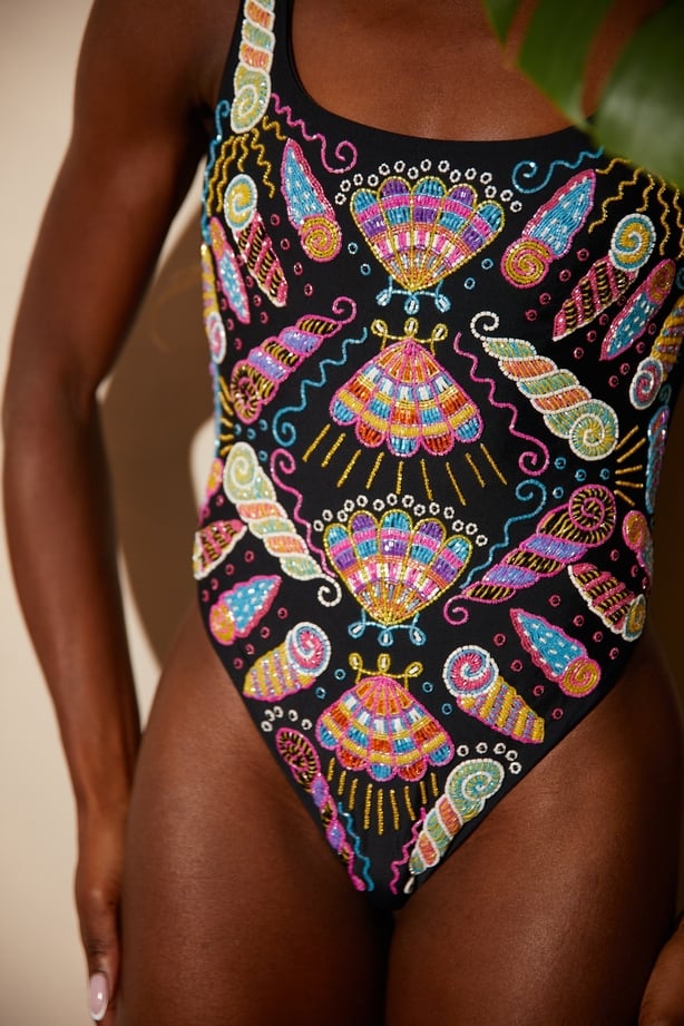 a person wearing a colourful swimsuit