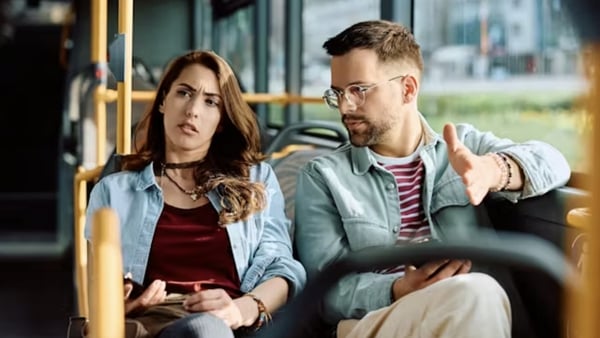 young couple woman man argument bus