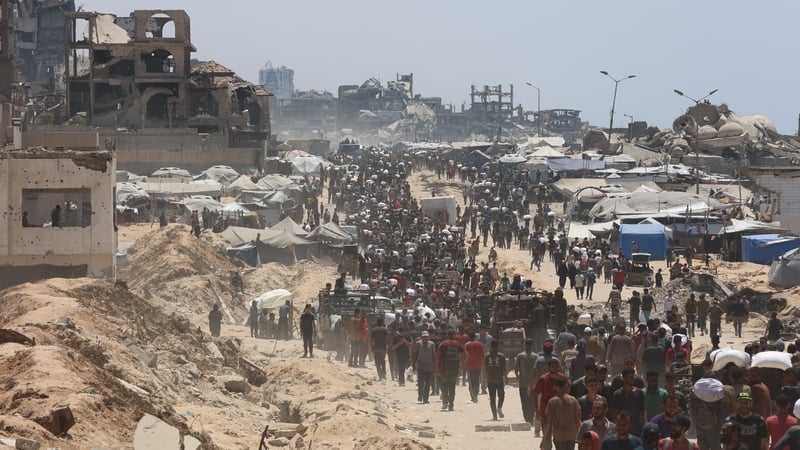 People move towards an aid point in the Zakim area of Gaza