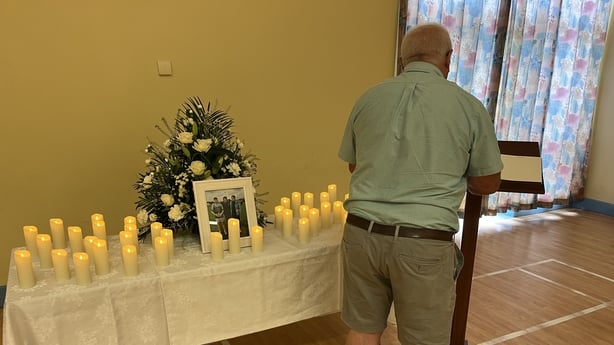 Man signs book of condolence at Maguiresbridge Primary School