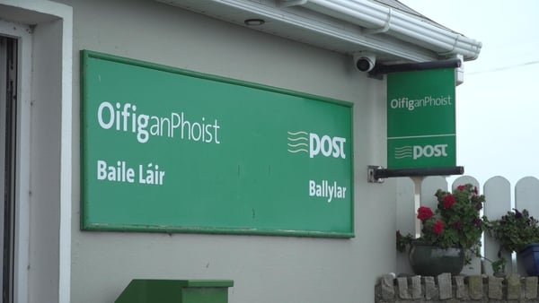 a green sign on a building