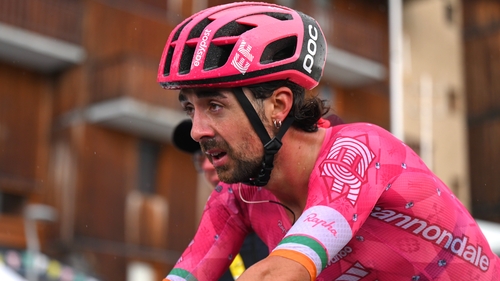 Ben Healy crossing the finish line at the end of stage 19