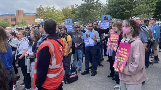 People attending an anti-racism vigil in Tallaght