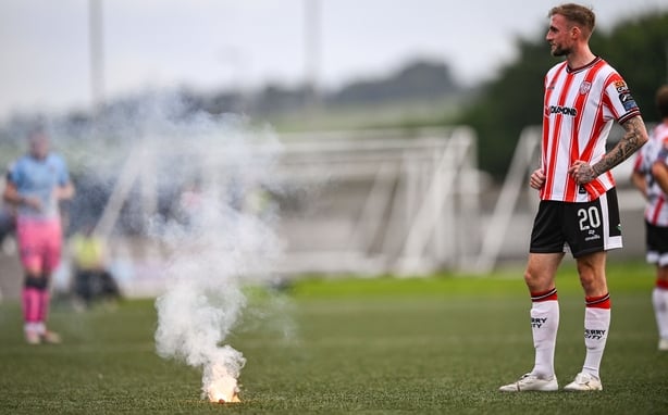 Carl Winchester of Derry City after a flare was thrown onto the pitch during the SSE Airtricity Men's Premier Division match between Derry City and Bohemians at The Ryan McBride Brandywell Stadium in Derry.