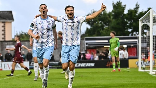 25 July 2025; Pádraig Amond of Waterford celebrates with team-mate Grant Horton, right, after scoring their side's fourth goal, from a penalty, during the SSE Airtricity Men's Premier Division match between Galway United and Waterford at Eamonn Deacy Park