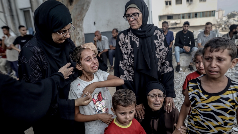 Relatives of Palestinians, who lost their lives after an Israeli attack on Gaza City