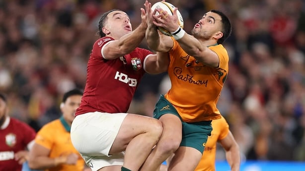 Australia's Tom Wright (R) and British and Irish Lions' James Lowe compete for a high-ball 