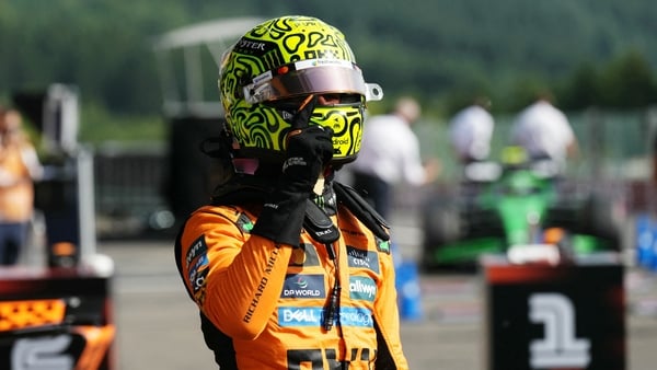 McLaren's British driver Lando Norris celebrates his pole position after the qualifying session ahead of the Formula One Belgian Grand Prix at the Spa-Francorchamps circuit in Spa, on July 26, 2025.