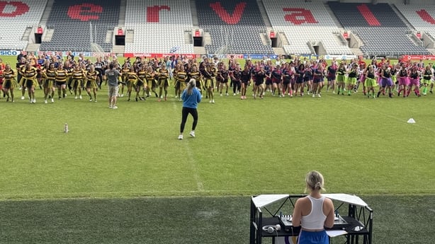 Cork All-Ireland winner Bríd Stack leading the warmup at today's Festival of Football and Wellbeing.