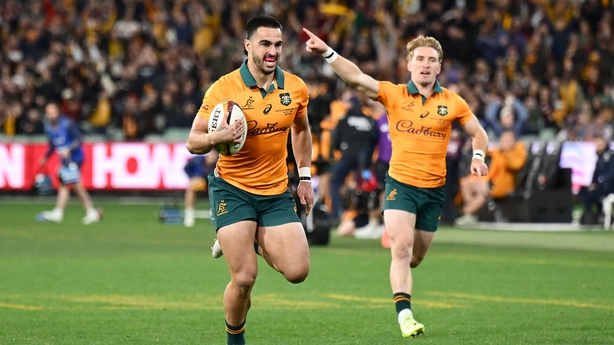 MELBOURNE, AUSTRALIA - JULY 26: Tom Wright of the Wallabies makes a break to score a try during the second test of the series between Australia Wallabies and British & Irish Lions at the Melbourne Cricket Ground on July 26, 2025 in Melbourne, Australia. (Photo by Hannah Peters/Getty Images)