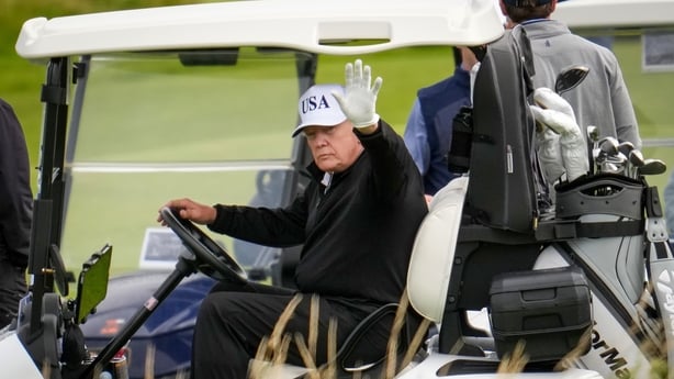 a person in a golf cart