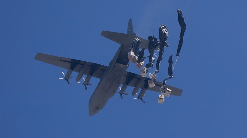 An airplane drops humanitarian aid over Gaza this afternoon