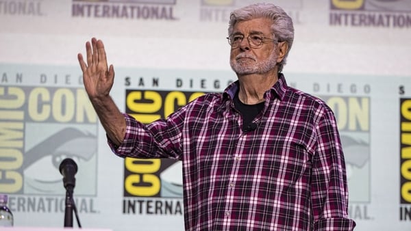 SAN DIEGO, CALIFORNIA - JULY 27: George Lucas greets the crowd during the Sneak Peek: Lucas Museum Of Narrative Art panel on Day 4 of 2025 Comic-Con International at San Diego Convention Center on July 27, 2025 in San Diego, California. (Photo by Daniel K