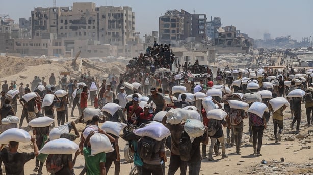 Palestinians receive humanitarian aid in Gaza (Photo credit should read Ramez Habboub / GocherImagery/Future Publishing via Getty Images)
