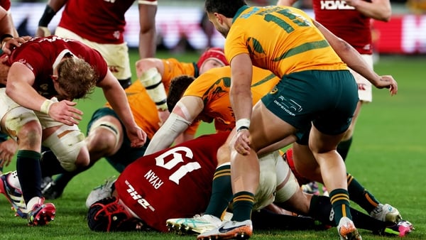 26 July 2025; Jac Morgan of British & Irish Lions, left, goes in to clear out Carlo Tizzano of Australia at a ruck in the lead up to the Lions fifth try, scored by Hugo Keenan, not pictured, during the second test match between Australia and the British &