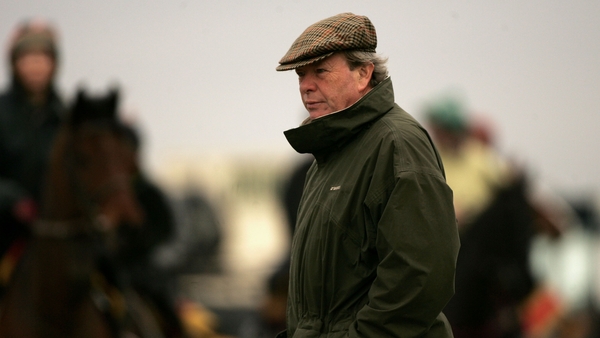 CHELTENHAM, ENGLAND - MARCH 12: Trainer Edward O'Grady watches his horses head out to take part in an early morning gallop at Cheltenham Racecourse on March 12, 2007, in Cheltenham, England. The annual National Hunt Festival is due to start at The Glousre